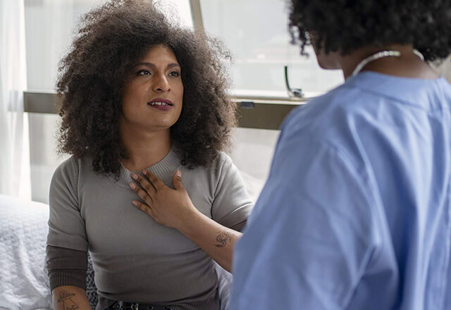 Nurse examining a transgender woman.