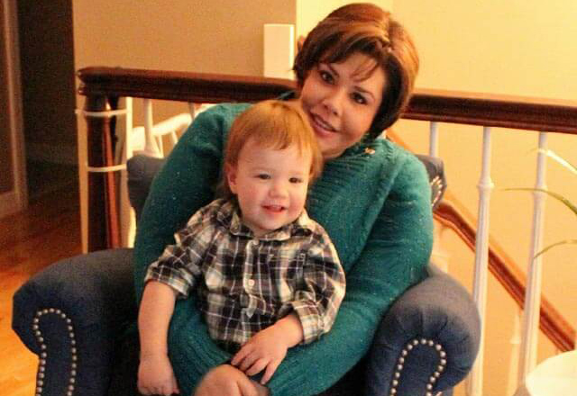 gynecologic oncology - Ashley seated with her baby son