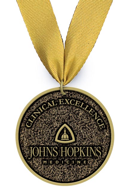 A photo shows an award for the Johns Hopkins Medicine Clinical Awards.  