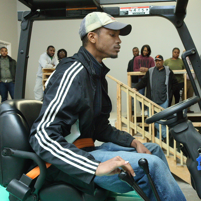 The photo shows Darien Porter on a forklift.