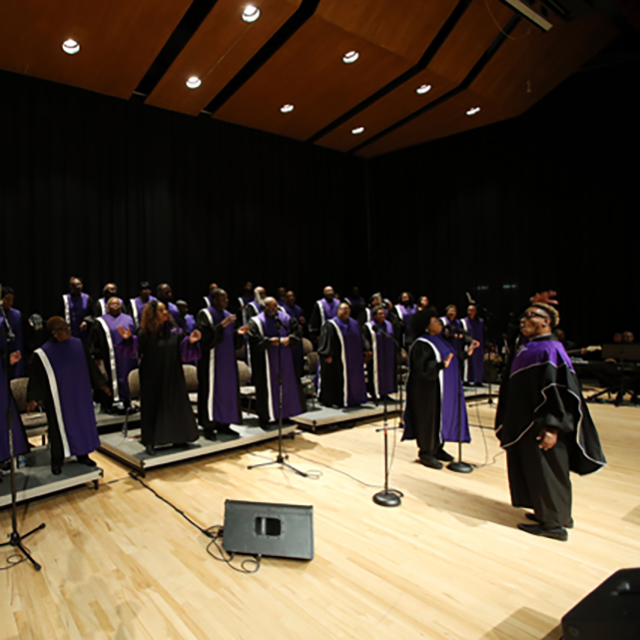 An image shows the Unified Voices choir. 