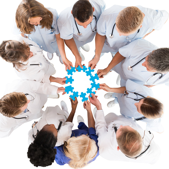 Image shows clinicians piecing together a jigsaw puzzle.