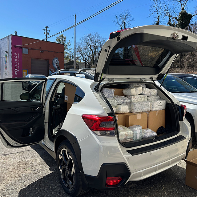 Thousands of diapers and supplies are stuffed into vehicles so Johns Hopkins Medicine can ensure patients have the essentials to care for their families. 