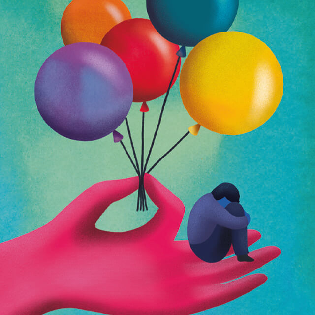 a child sits on a hand that's holding balloons