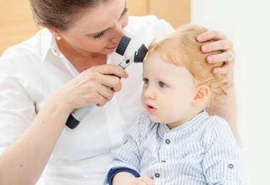 dermatologist checking baby's skin
