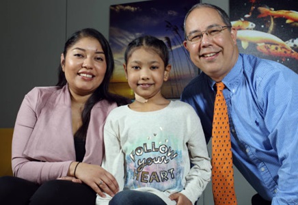 Stephanie Brown with her daughter, Maiyah, and pediatric cardiologist William Ravekes.