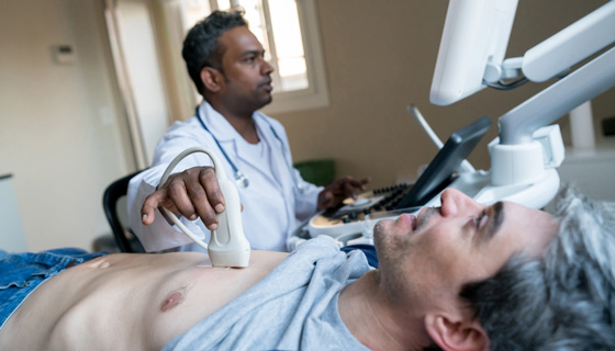 Doctor performing cardiac ultrasound