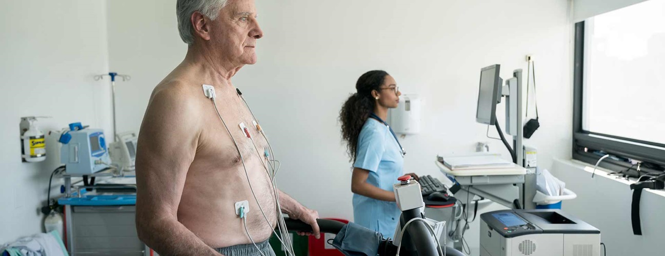 A senior man undergoes a stress echocardiogram.
