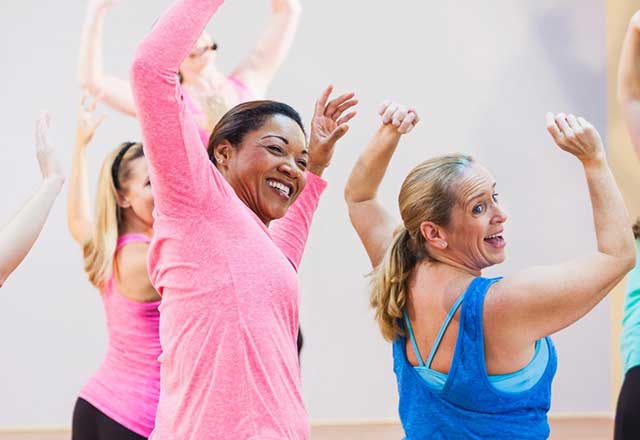 A group of women having fun in an exercise class.