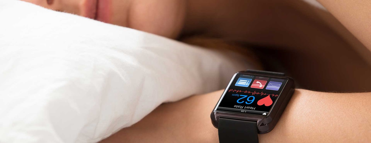 A person sleeping with a smart watch