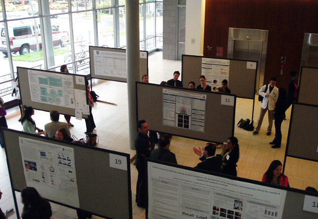 attendees looking at posters