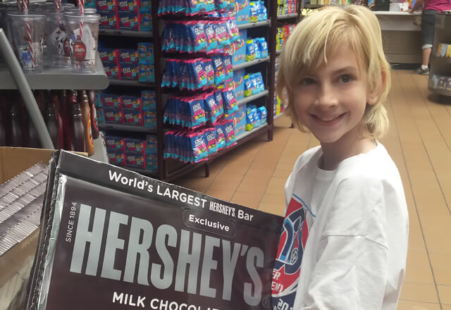 Anderson holding a giant chocolate bar