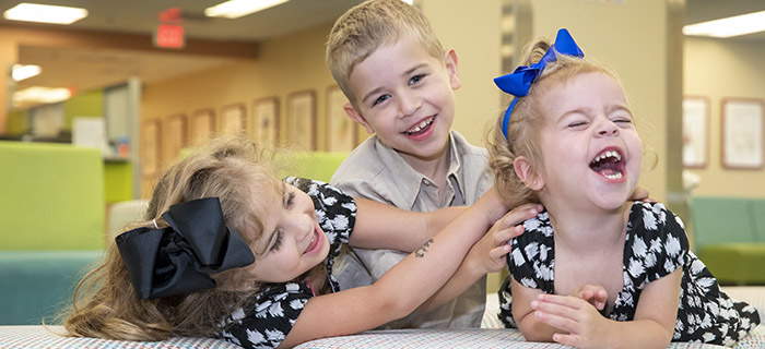 Siblings Jaxson and Adelyn who both had Congenital Diaphragmatic Hernia (CDH) and were treated by David Kays, M.D., pictured with their sister, Ava