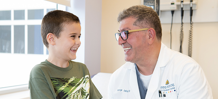 Doctor George Jallo with a little boy at Johns Hopkins All Children's Hospital.