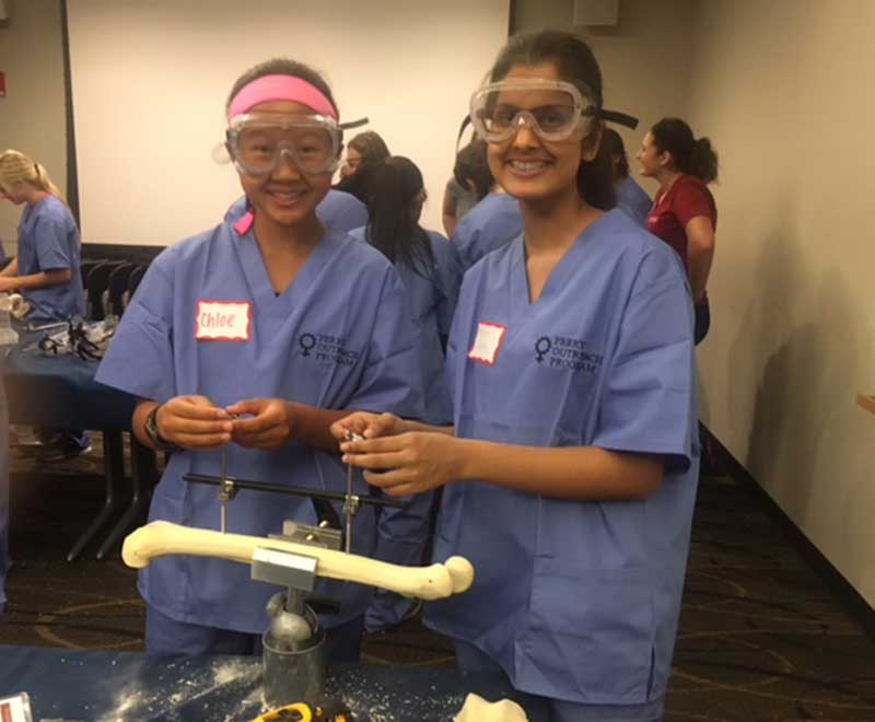 High schoolers examining bone