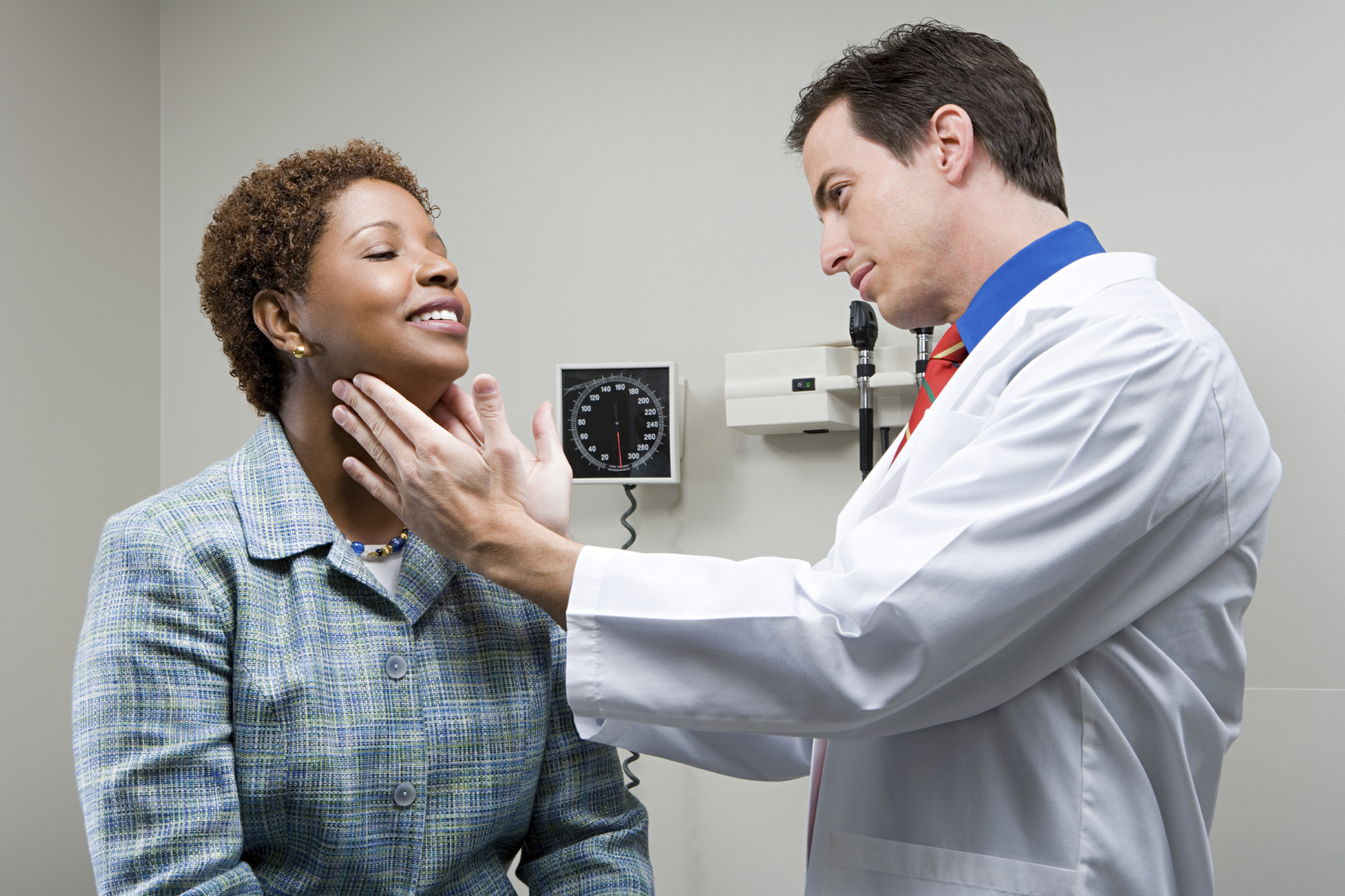 Doctor checking patients throat. 