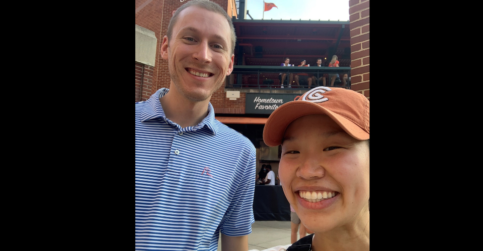 two chief residents smiling in orioles hats