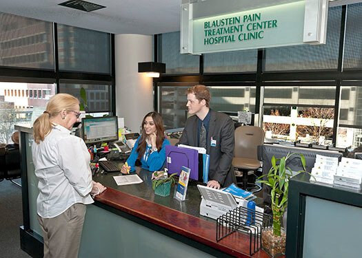 Photo of a patient checking in at the Blaustein Pain Treatment Center