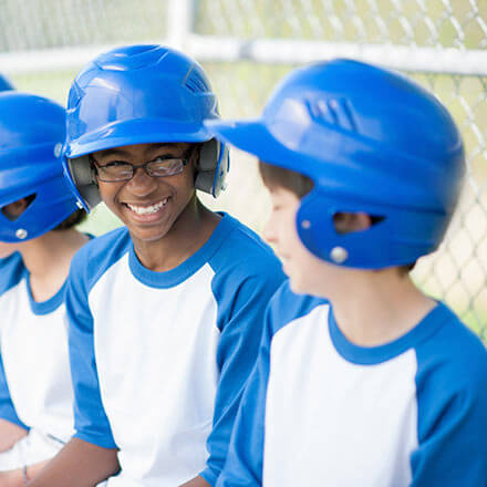 Kids in a baseball dugout