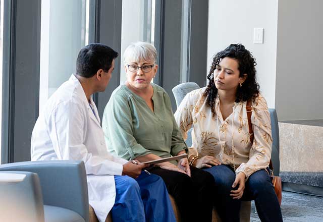 A physician talking to a family in the hospital.