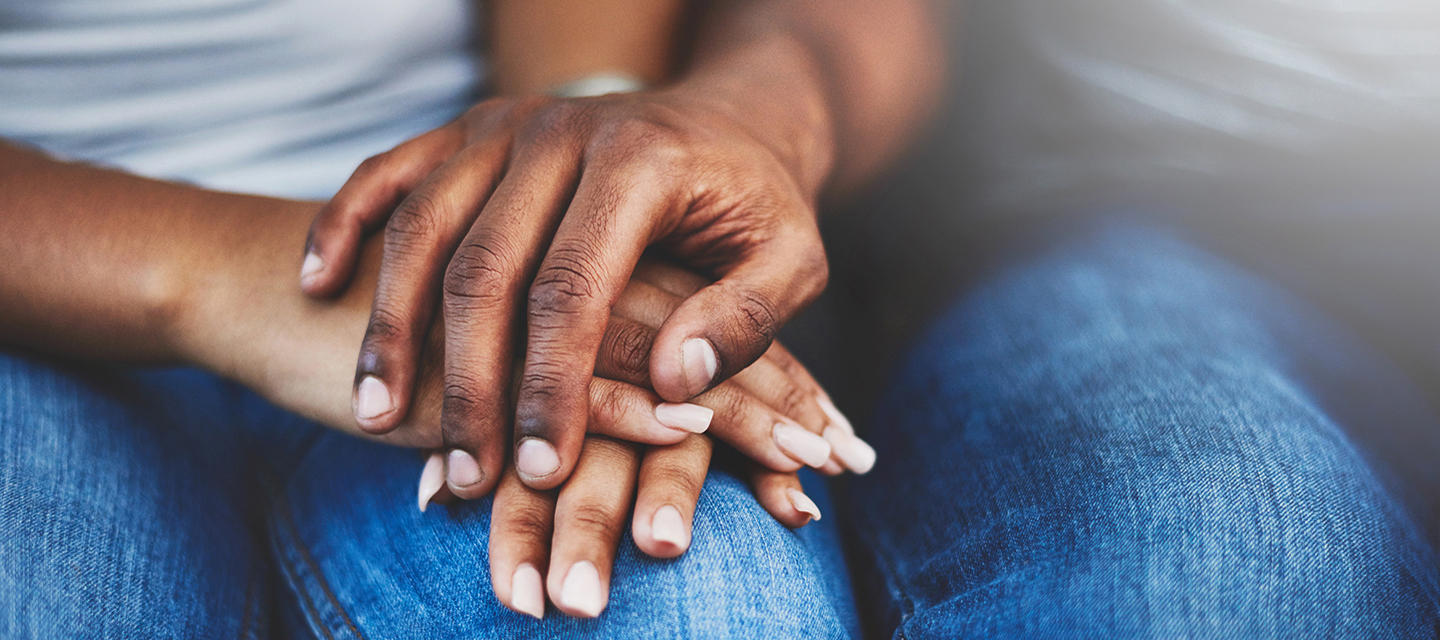 closeup of two peoples held hands