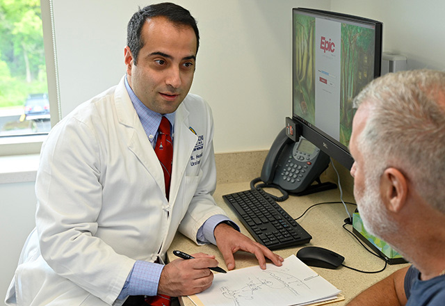 Doctor speaking with older patient in office