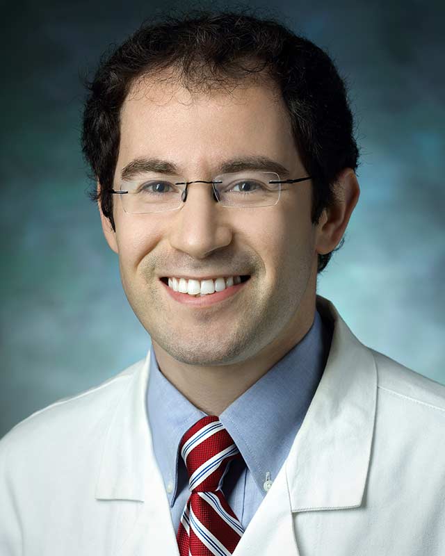 Dr. Alexander Pantelyat wearing white coat