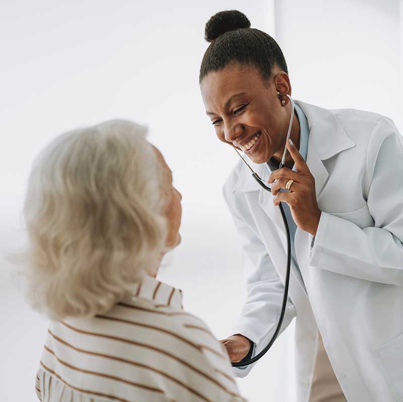 Doctor listens to a patient's heart with a stethoscope