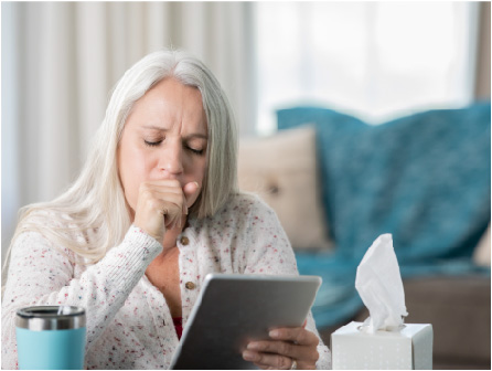 woman coughing on tablet