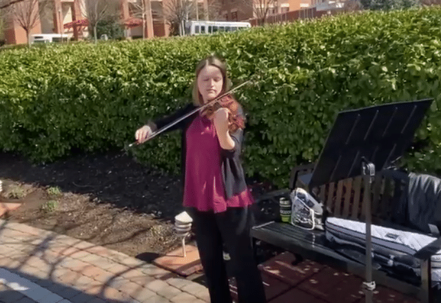 Violinist playing outside