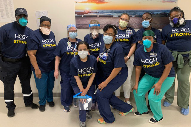 Group of doctors and nursing wearing masks and HCGH Strong t-shirts