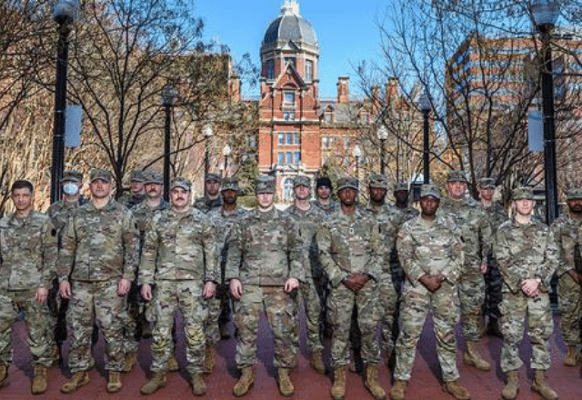 Group of national guardspeople in front of the Hopkins dome