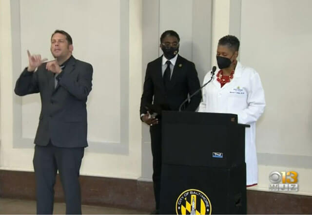 Johns Hopkins staff participating in a press conference for WJZ-13