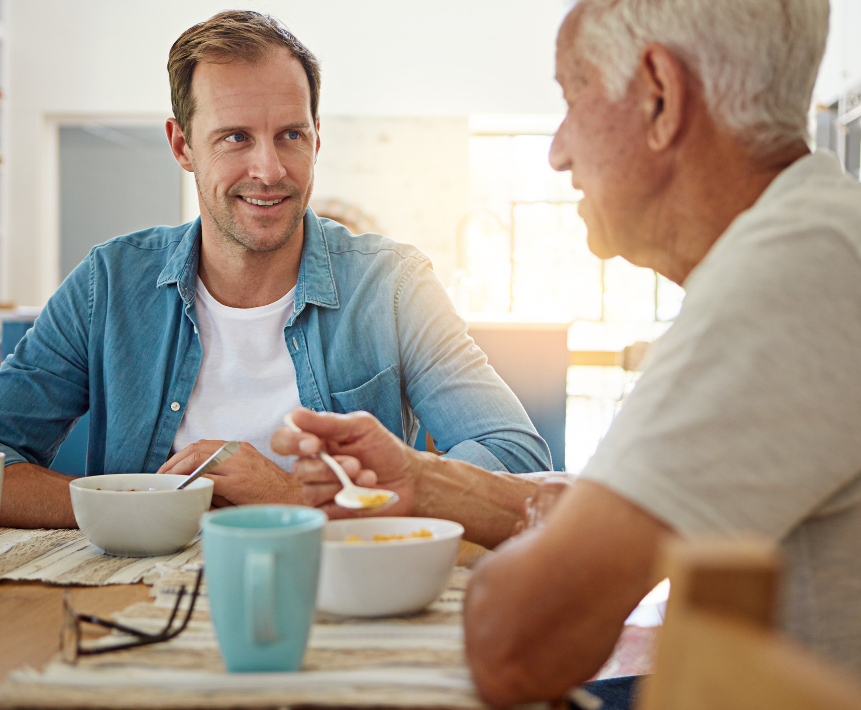 Father and son eat breakfast the morning of dermatological surgery