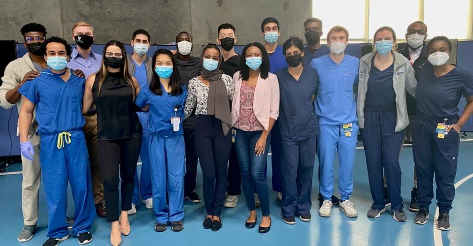 Masked students in scrubs