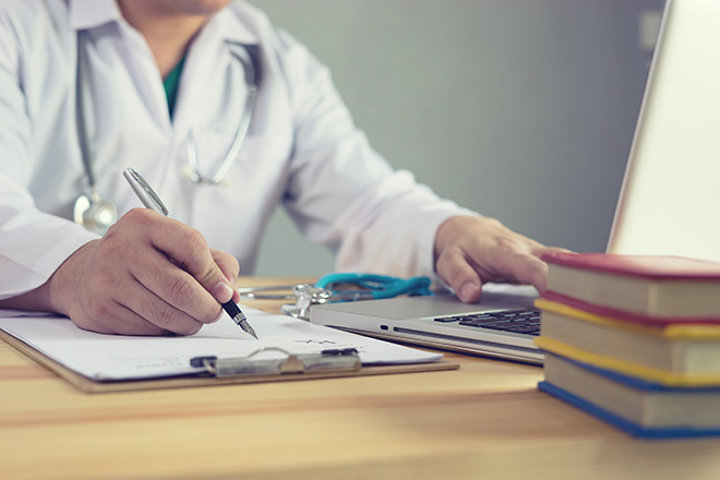 Doctor writing notes