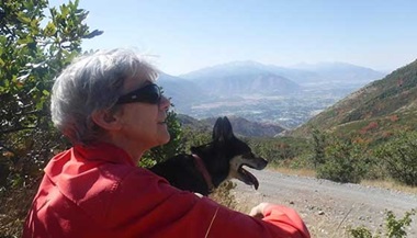 Jane enjoying a hike with her dog, post-surgery.