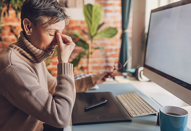 a woman holding her eyes because they are dry