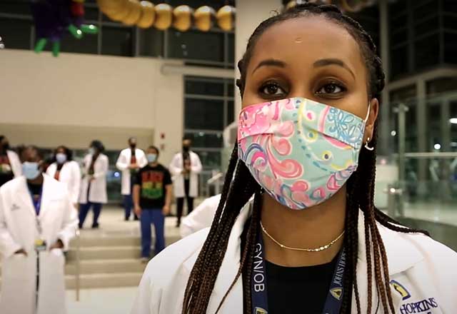 Black female doctor in face mask