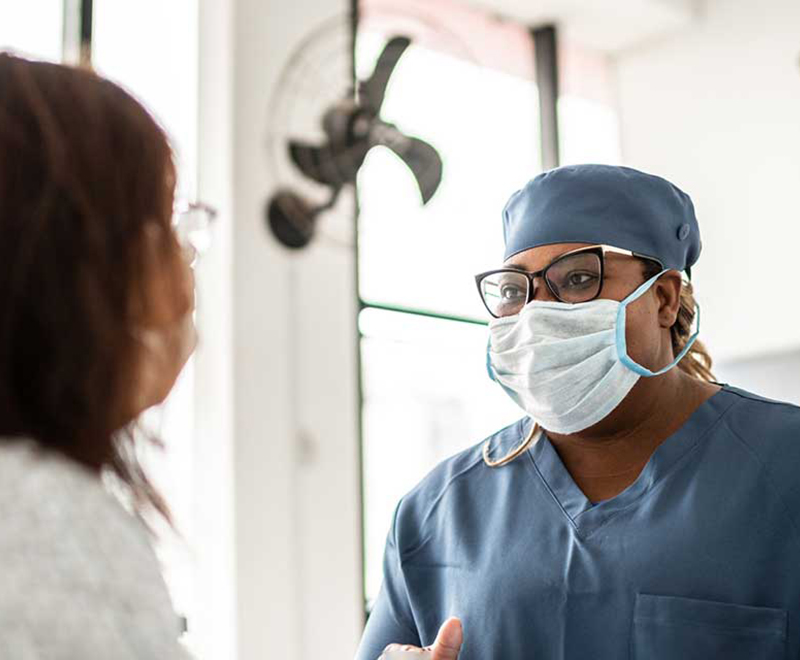 Patient with doctor in mask