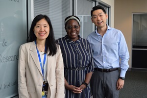 2023 Fellows Kacey Chae, Kara Alcegueire and Joseph Hwang smile for a photo at the Welch Center.