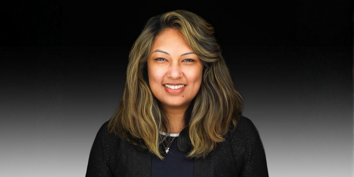 Ivy Akid smiles for a professional photo