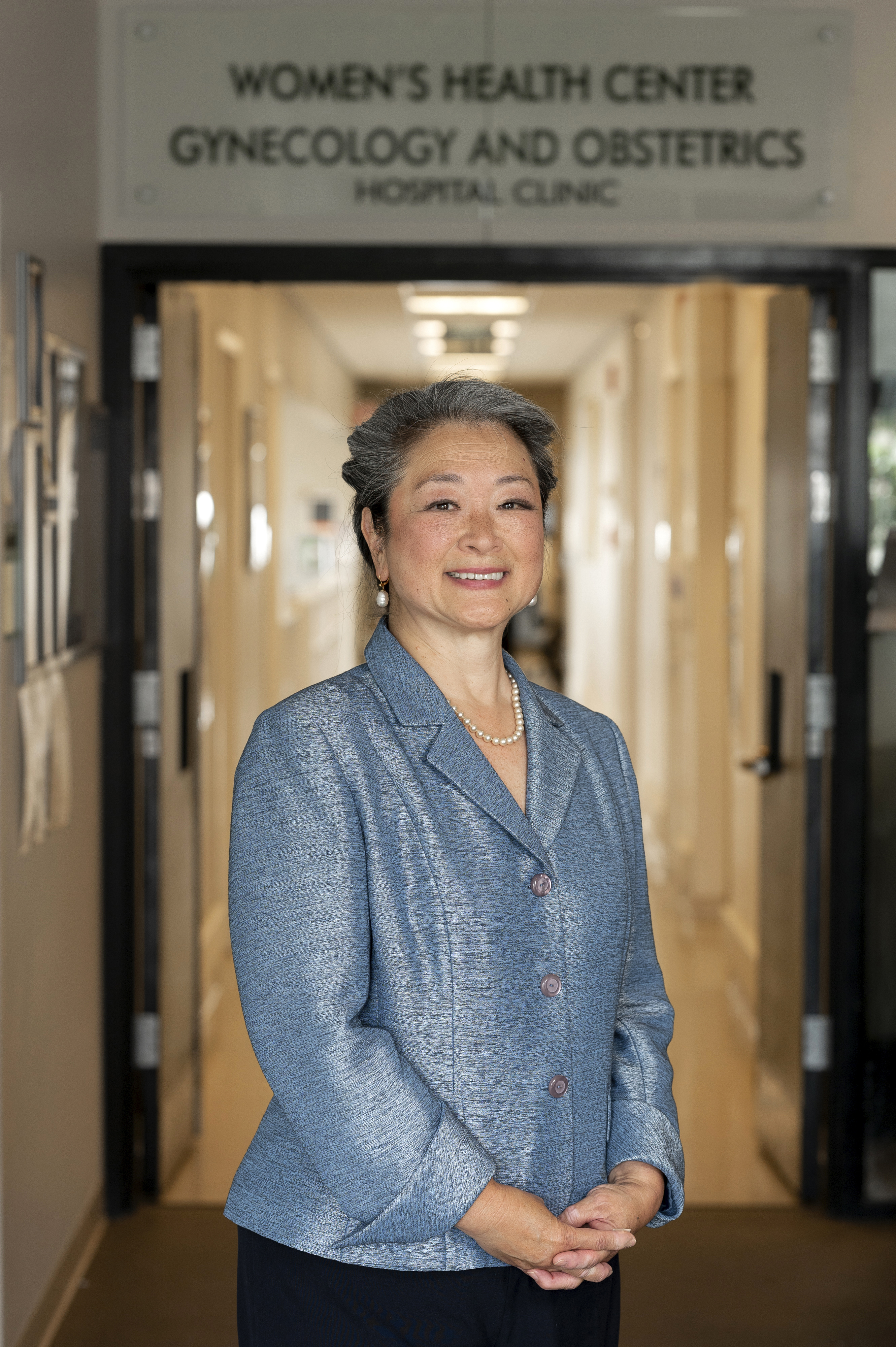 Dr. Wen Shen smiles for a professional portrait.