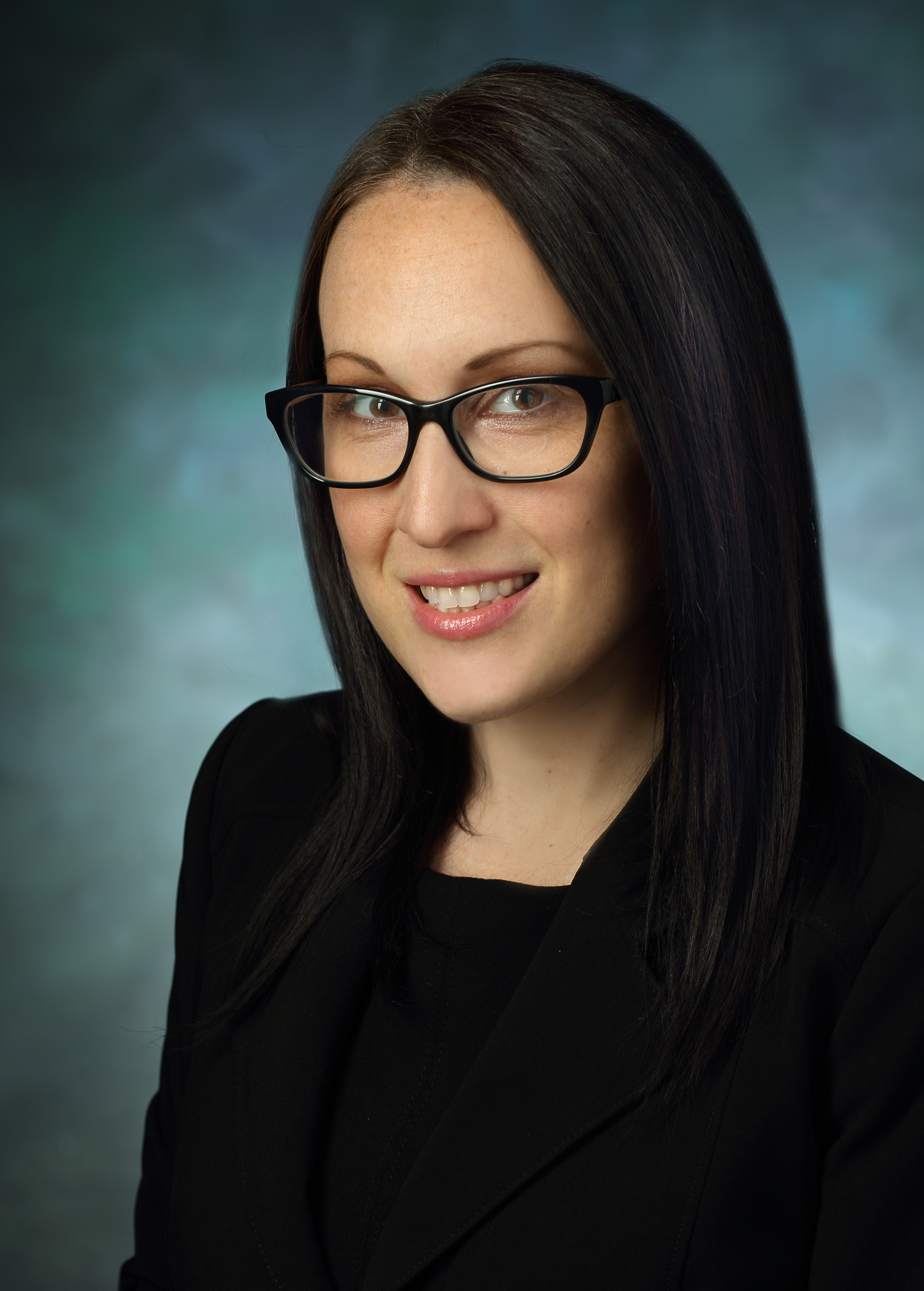 Marci Laudenslager smiles for a professional headshot