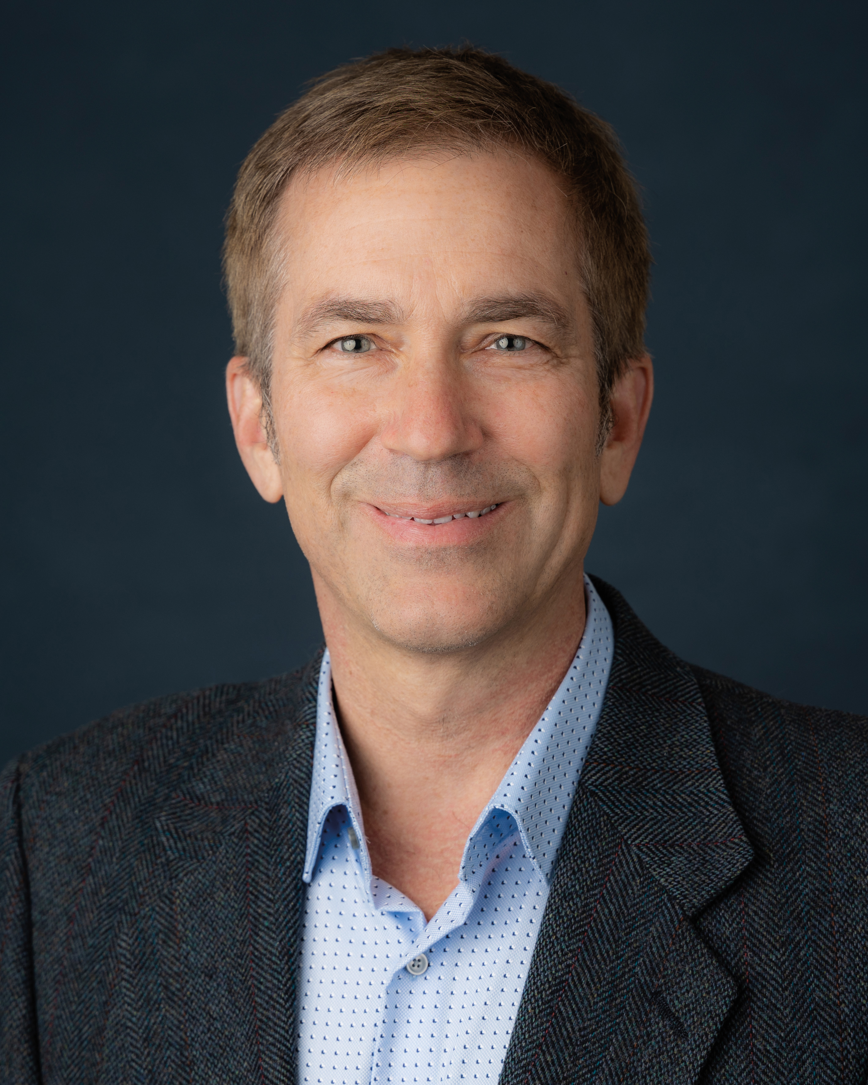 Jeremy Walston head shot against dark background