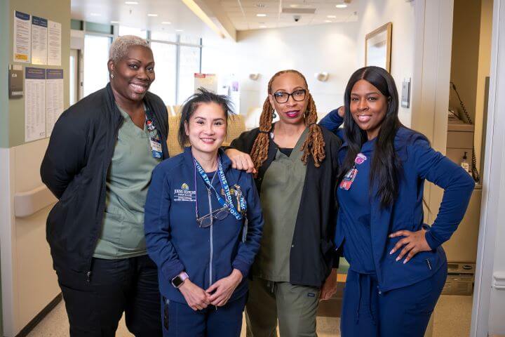 four nurses together at doctor's office