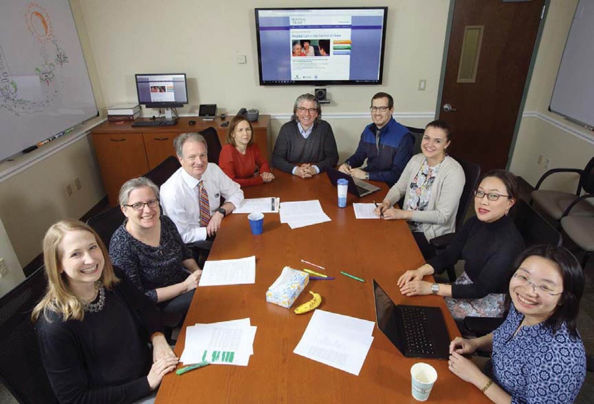 team of doctors around a table