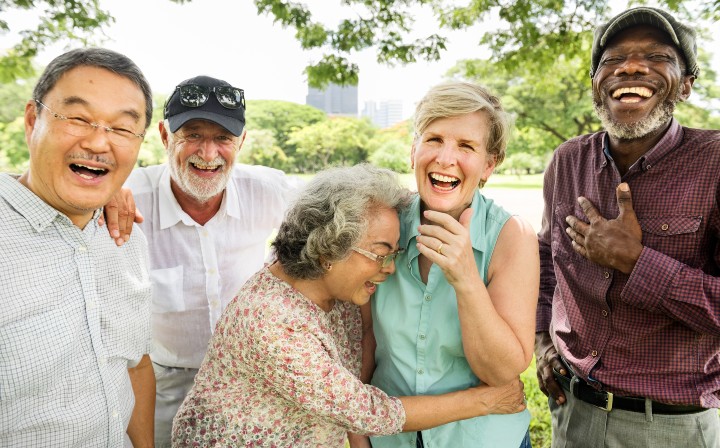 diverse group of older adults laughing together