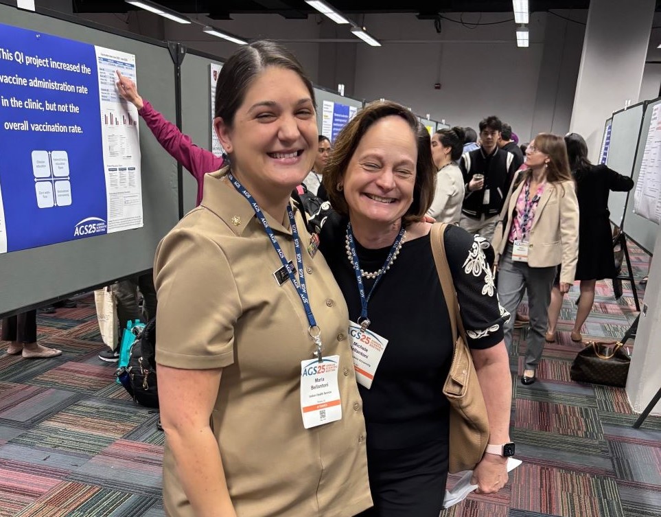 two doctors smiling at a conference