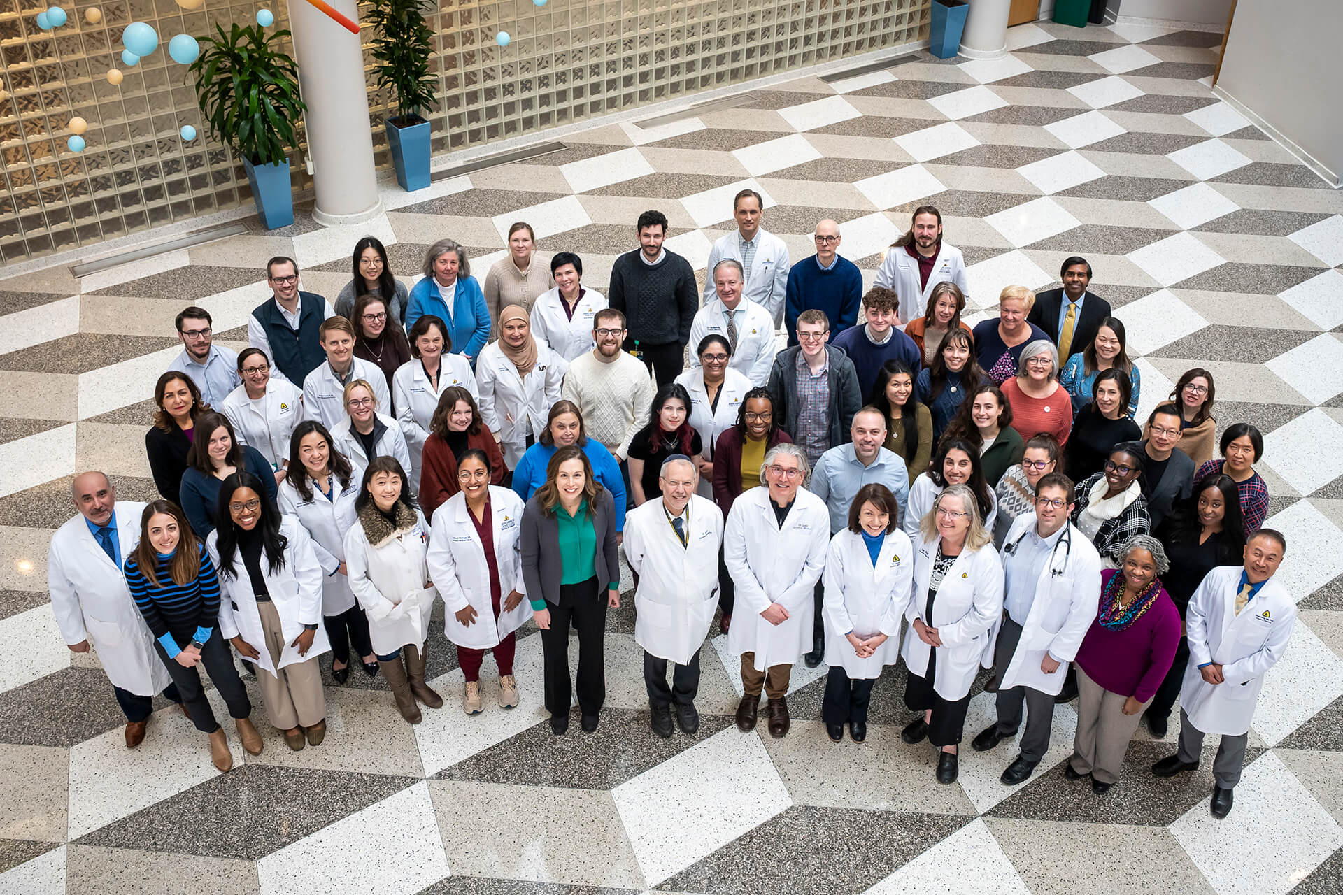 division group photo of doctors, nurses, and staff